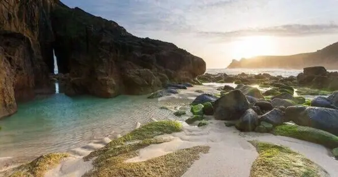 Hidden Beach Features Enchanting Emerald Lagoon in Idyllic Cove