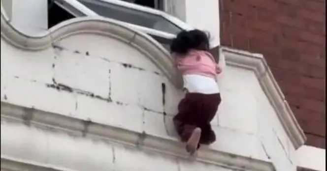 Bystander and Police Team Up to Rescue Toddler from Dangerous Ledge