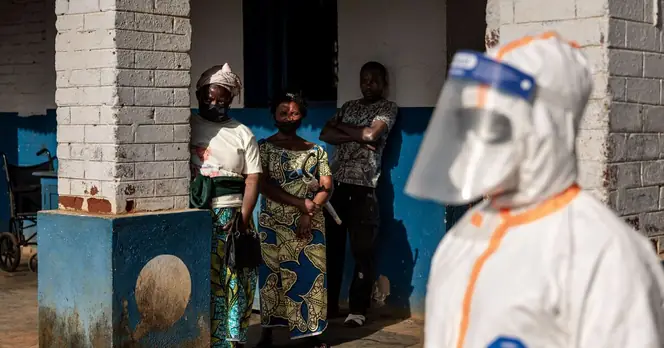Workers Remove Protective Gear in the Democratic Republic of Congo