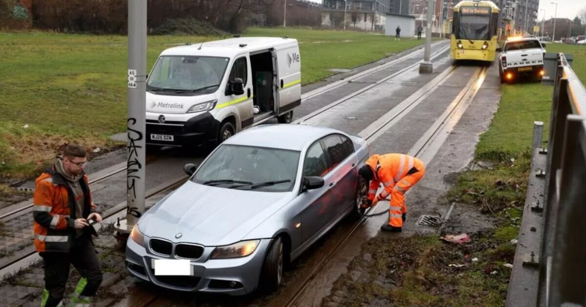 Manchester City Centre Faces Major Delays After BMW Gets Stuck on Tram Tracks
