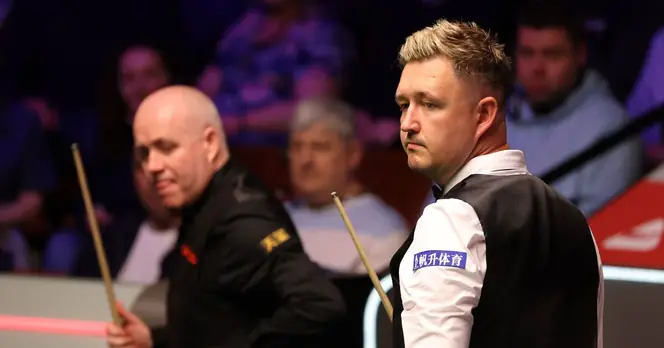 Kyren Wilson Competes Against John Higgins in Tense World Snooker Championship Match